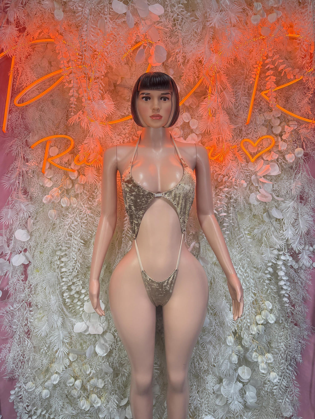 Gold rhinestone one-piece bodysuit with halter straps and deep V front