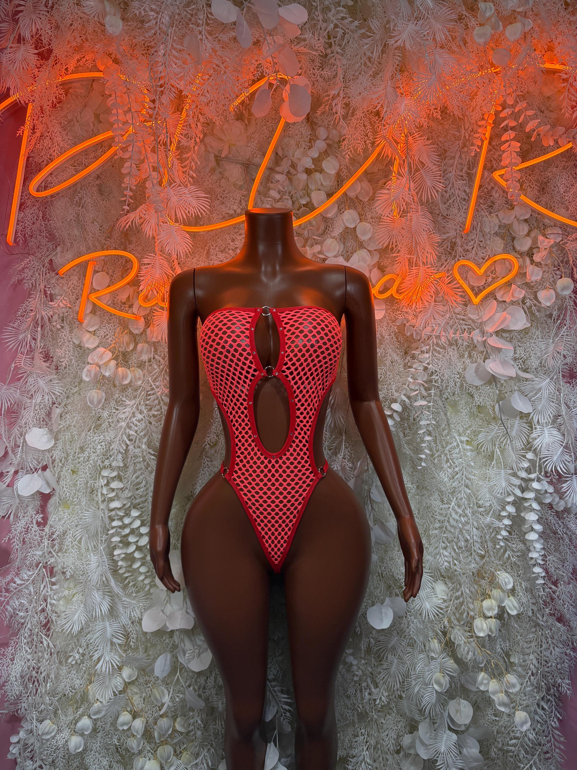 Red fishnet bodysuit with V-neck and keyhole front cutout