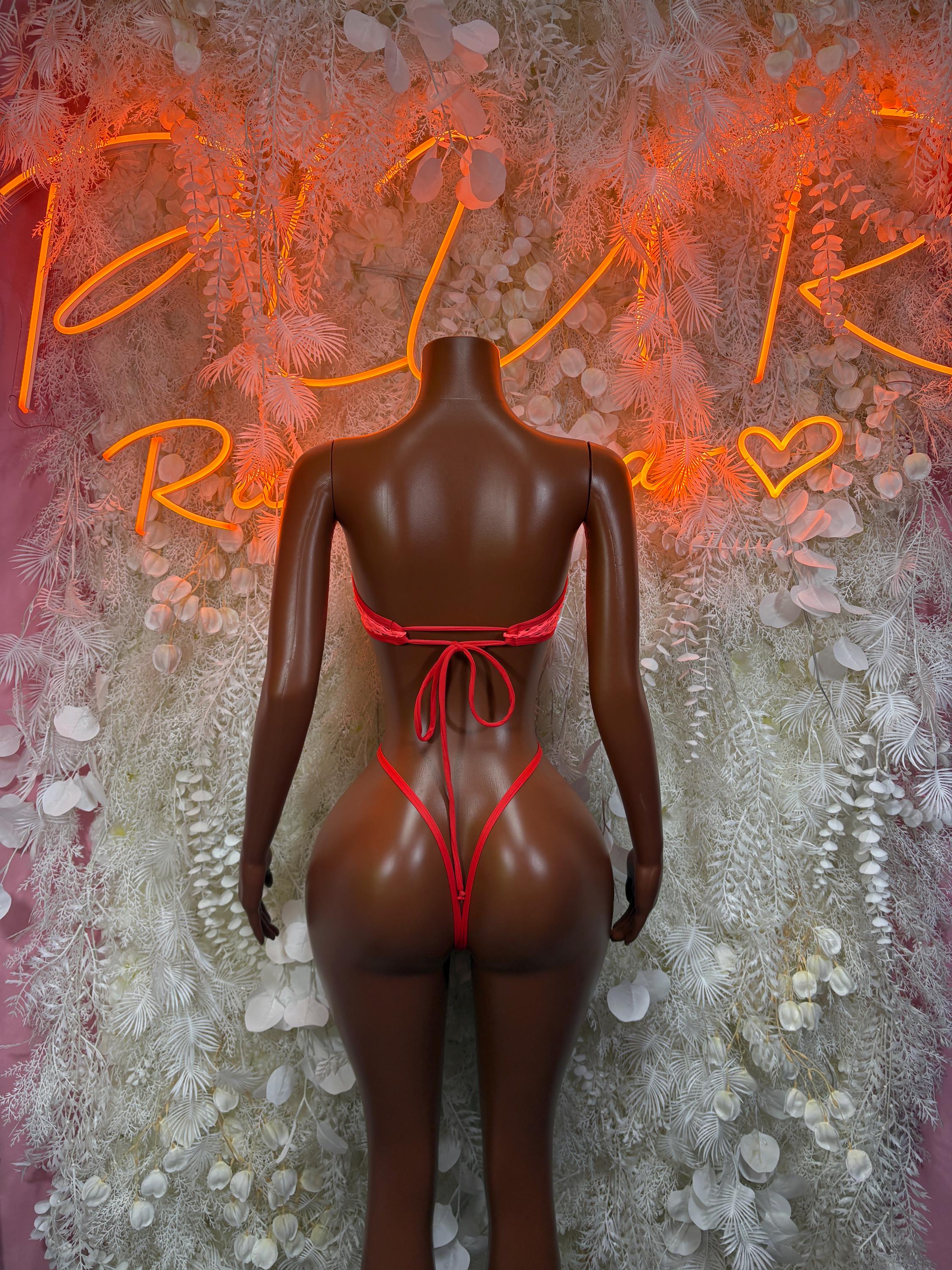Red fishnet bodysuit back view with lace-up straps and V-shaped cutout