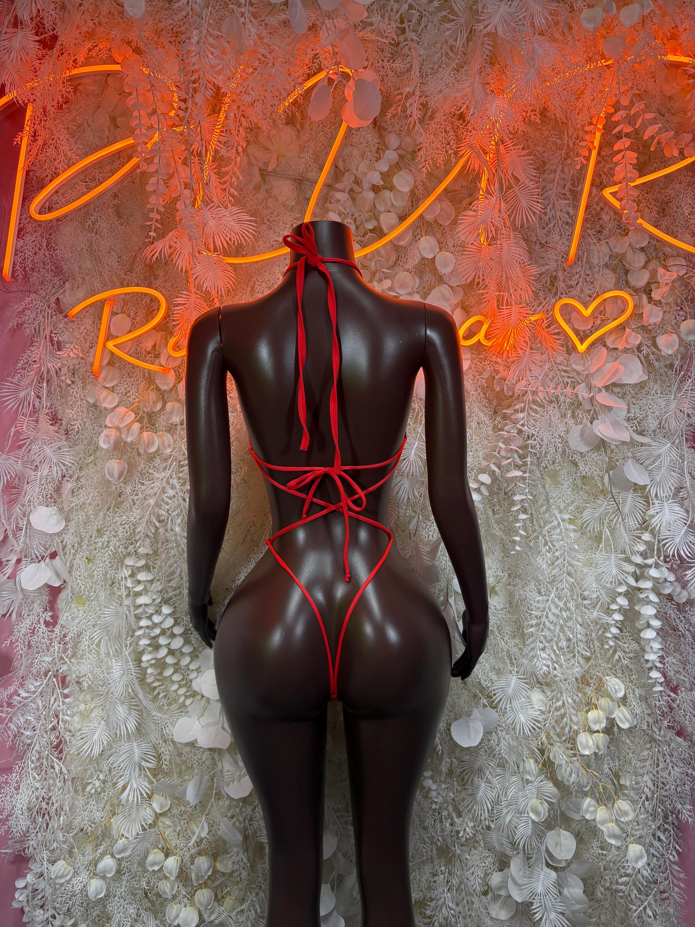Red fishnet bodysuit with lace-up back and high-cut leg design