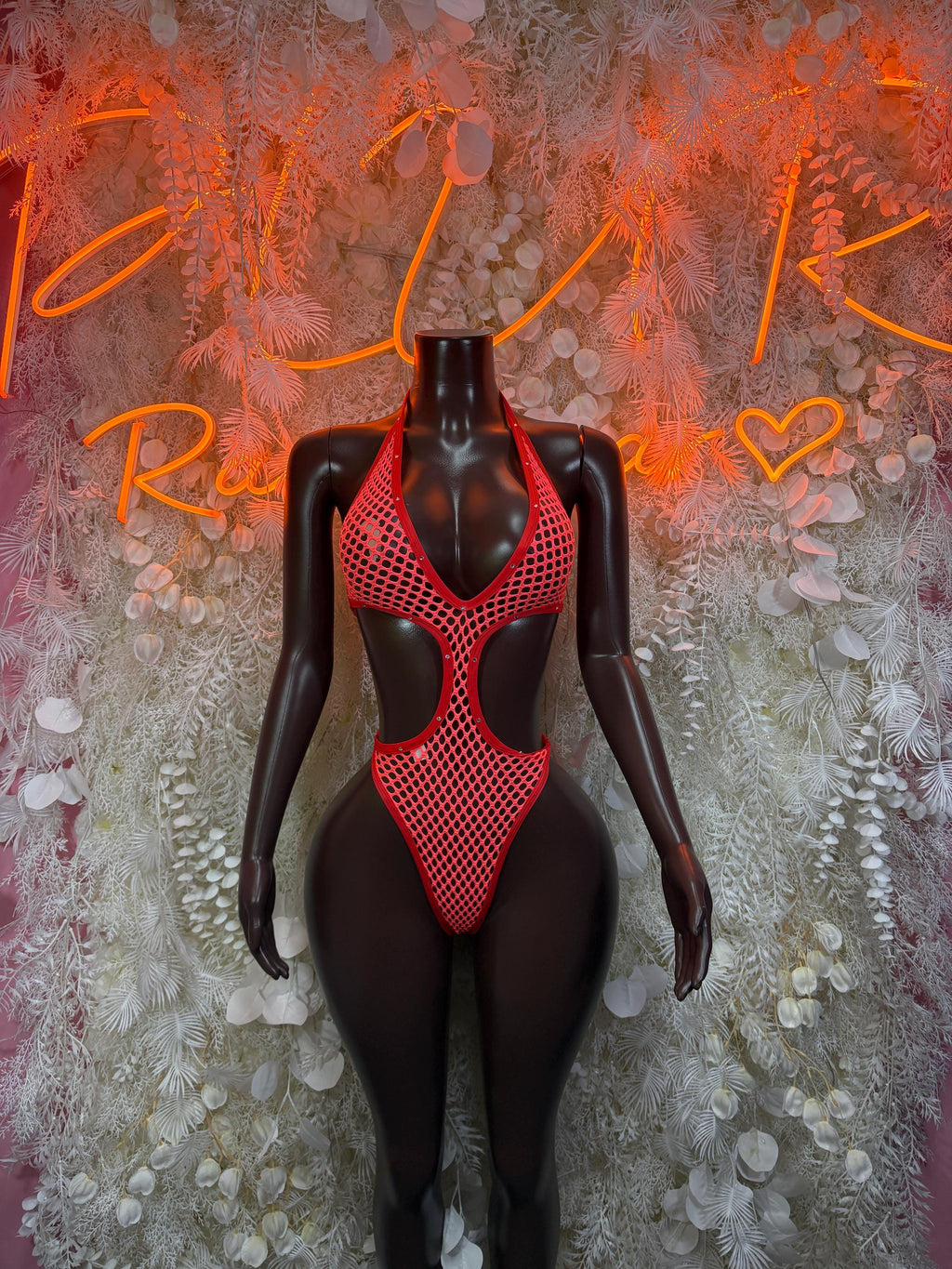 Red fishnet bodysuit with V-neck front and cutout bodice panels