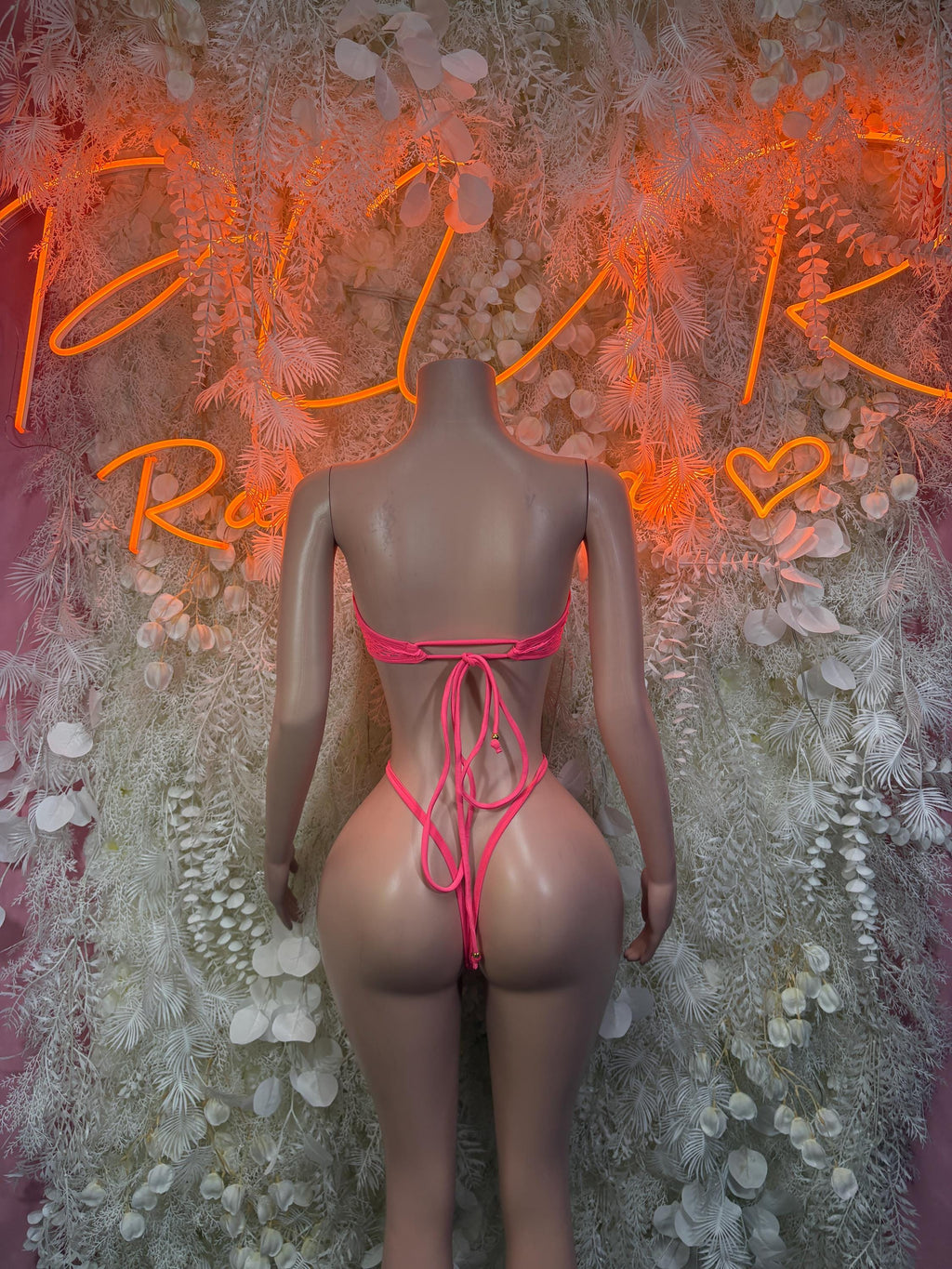 Coral mesh bodysuit with crisscross low-back ties and high-cut legs