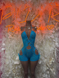 Blue lace bodysuit with halter straps, front cutouts, and thong-style bottom