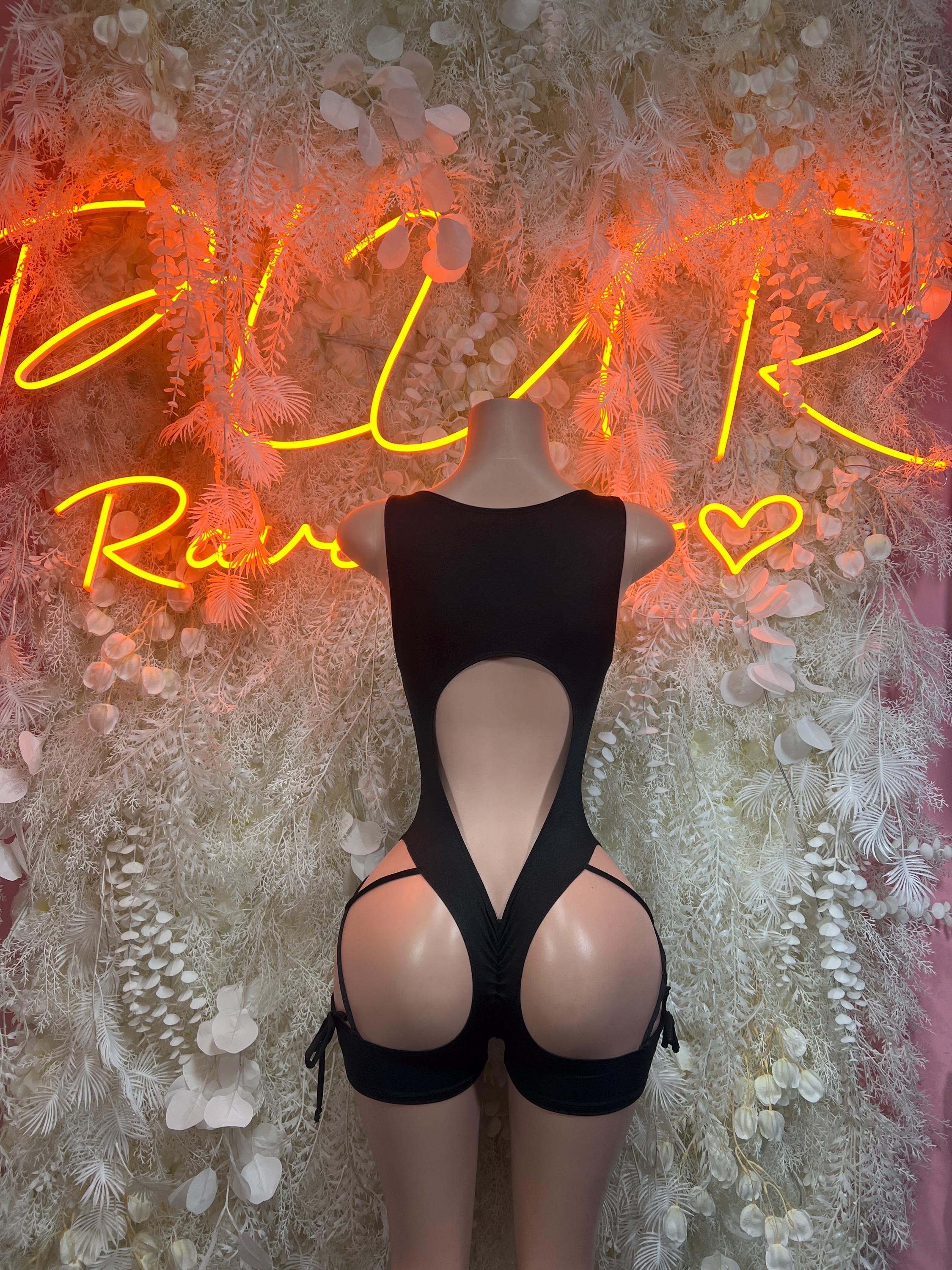 Black bodysuit with deep V back, lace-up front, and high-leg cutouts