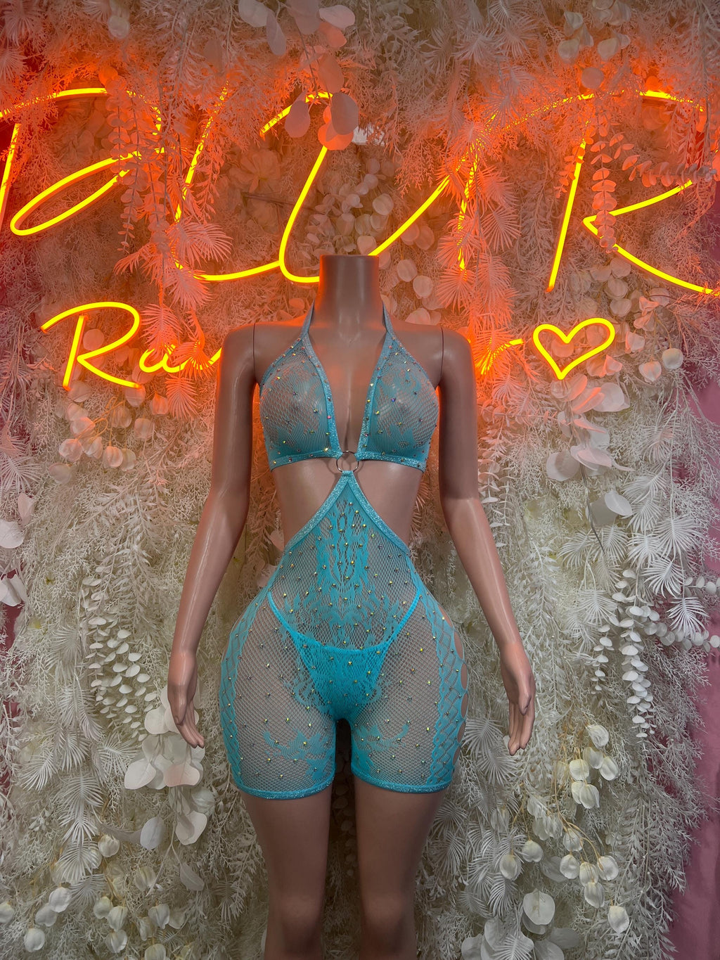 Blue fishnet bodysuit with triangle bra top and high-cut shorts
