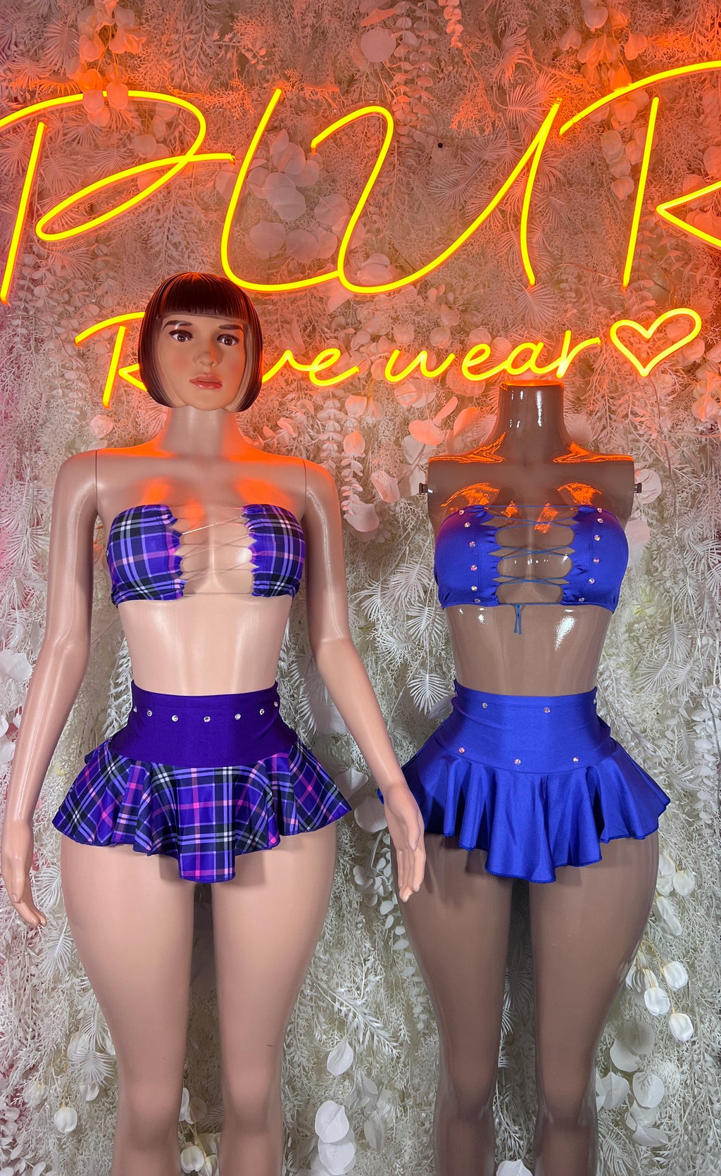 Purple plaid and solid blue ruffle skirt sets with bandeau tops, two models