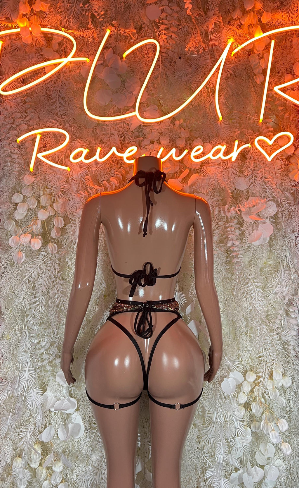 Back view of two-piece rave lingerie set, black lace and metallic trim
