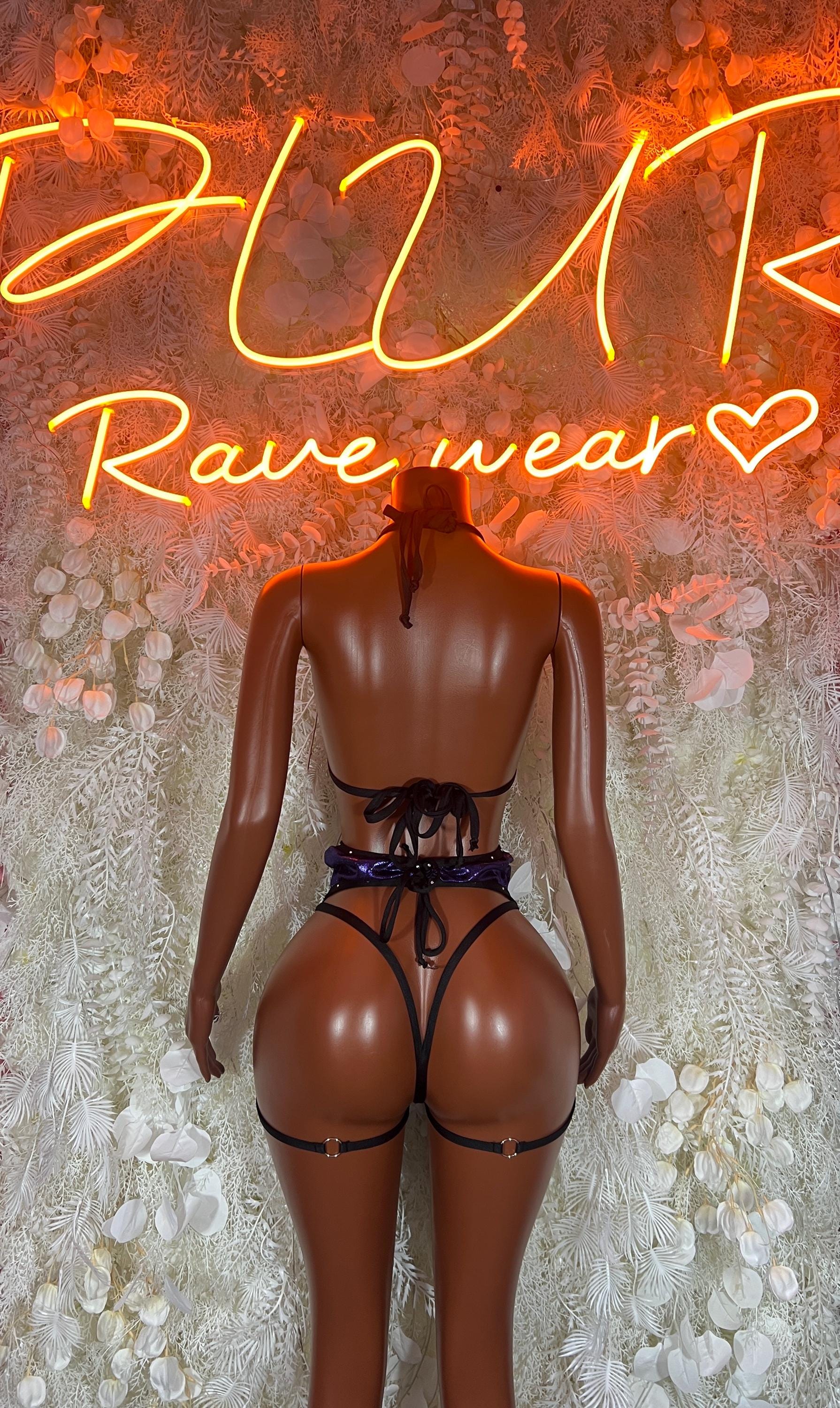 Two-piece rave outfit in purple metallic: backless bra and garter shorts, back view