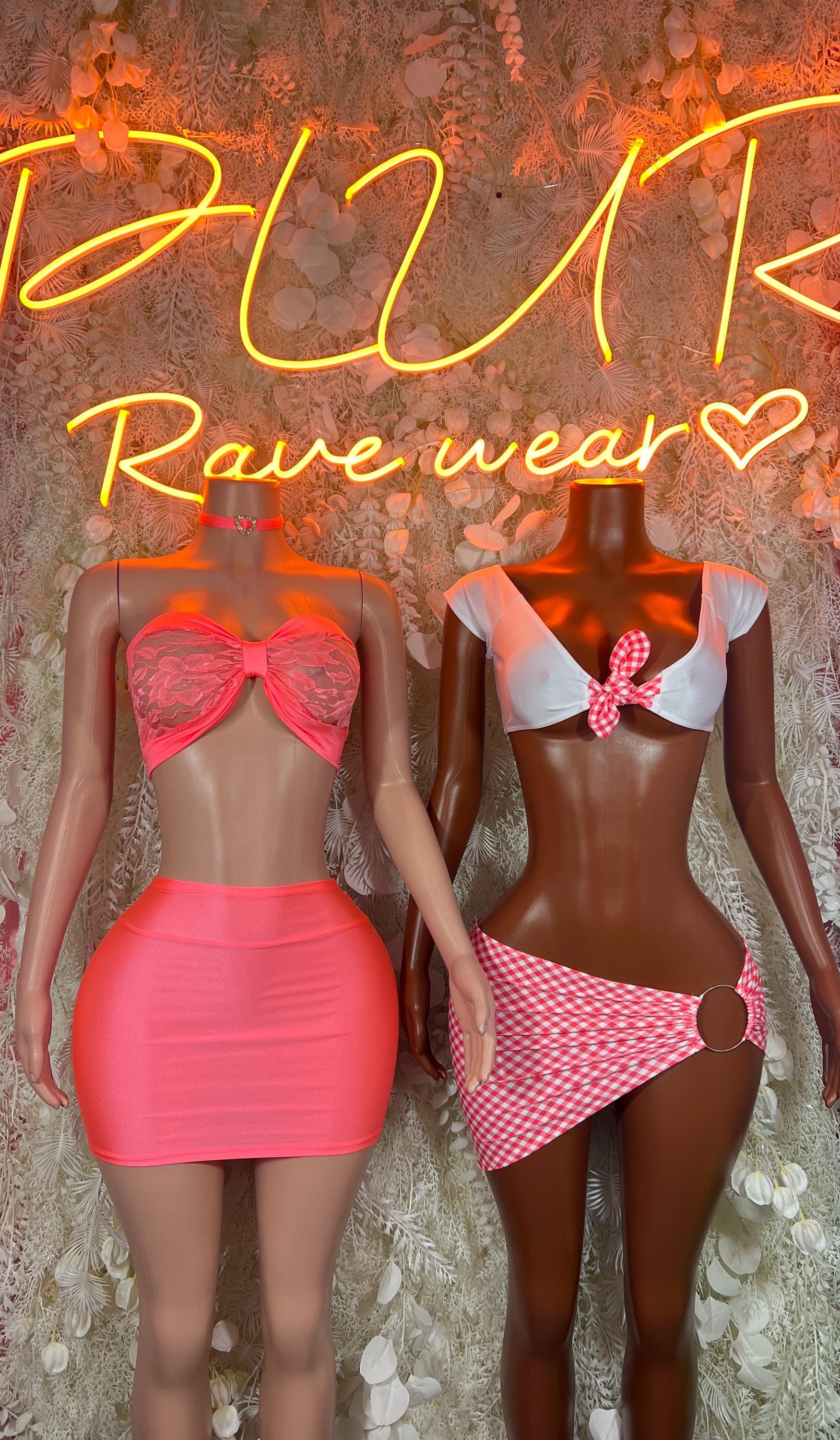 Pink heart bow crop top and mini skirt set on two models