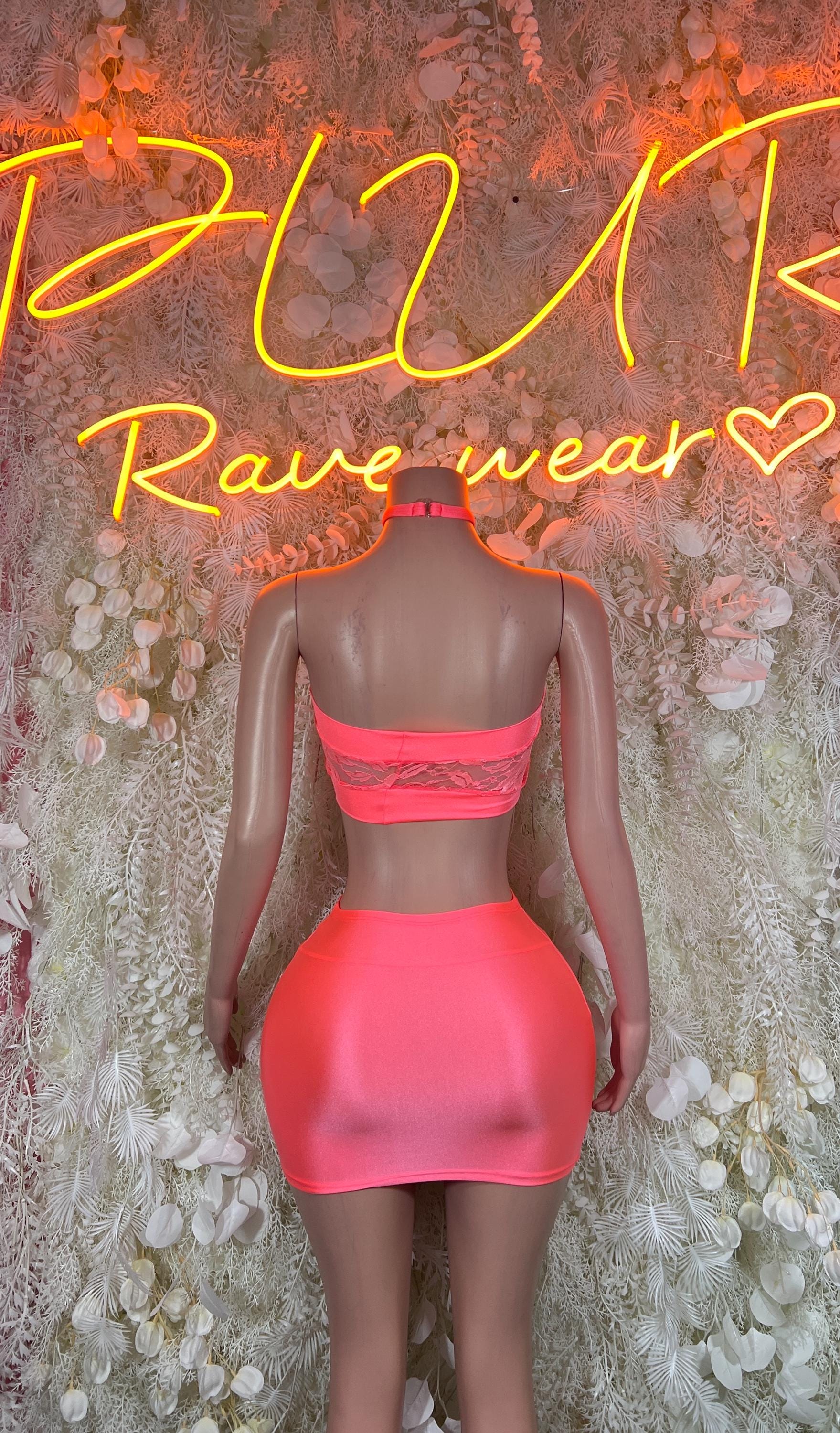 Neon pink bandeau top and mini skirt set, back view