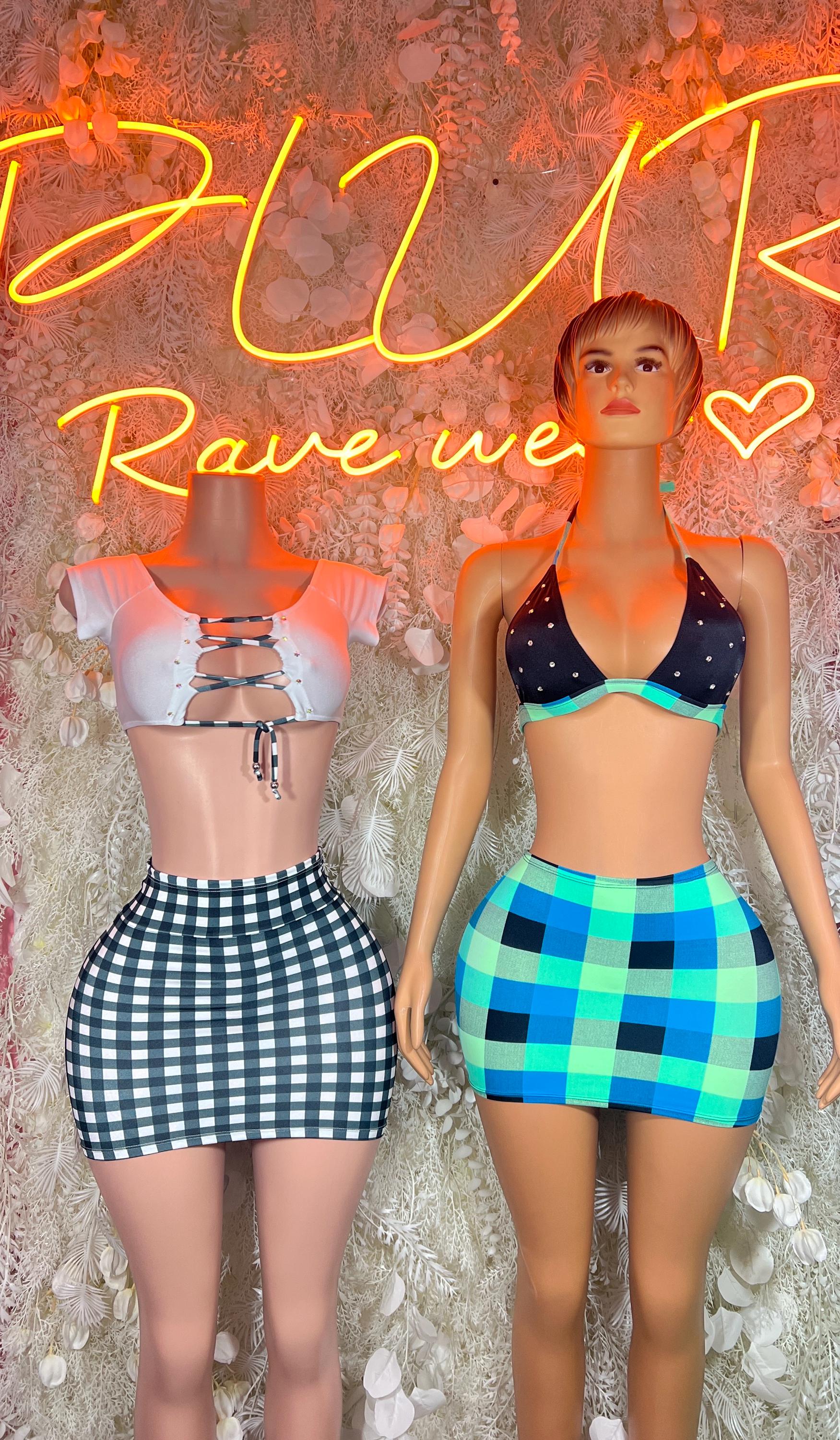 Two-piece festival outfits: light lace-up crop set and dark bra with blue grid mini skirt