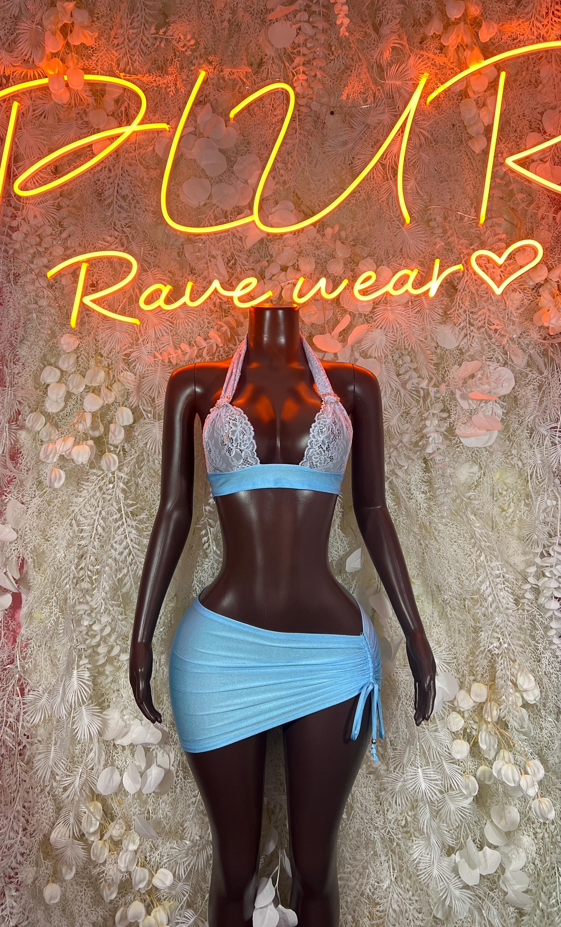 Blue lace two-piece skirt set with lace-trim bra top and tied mini skirt