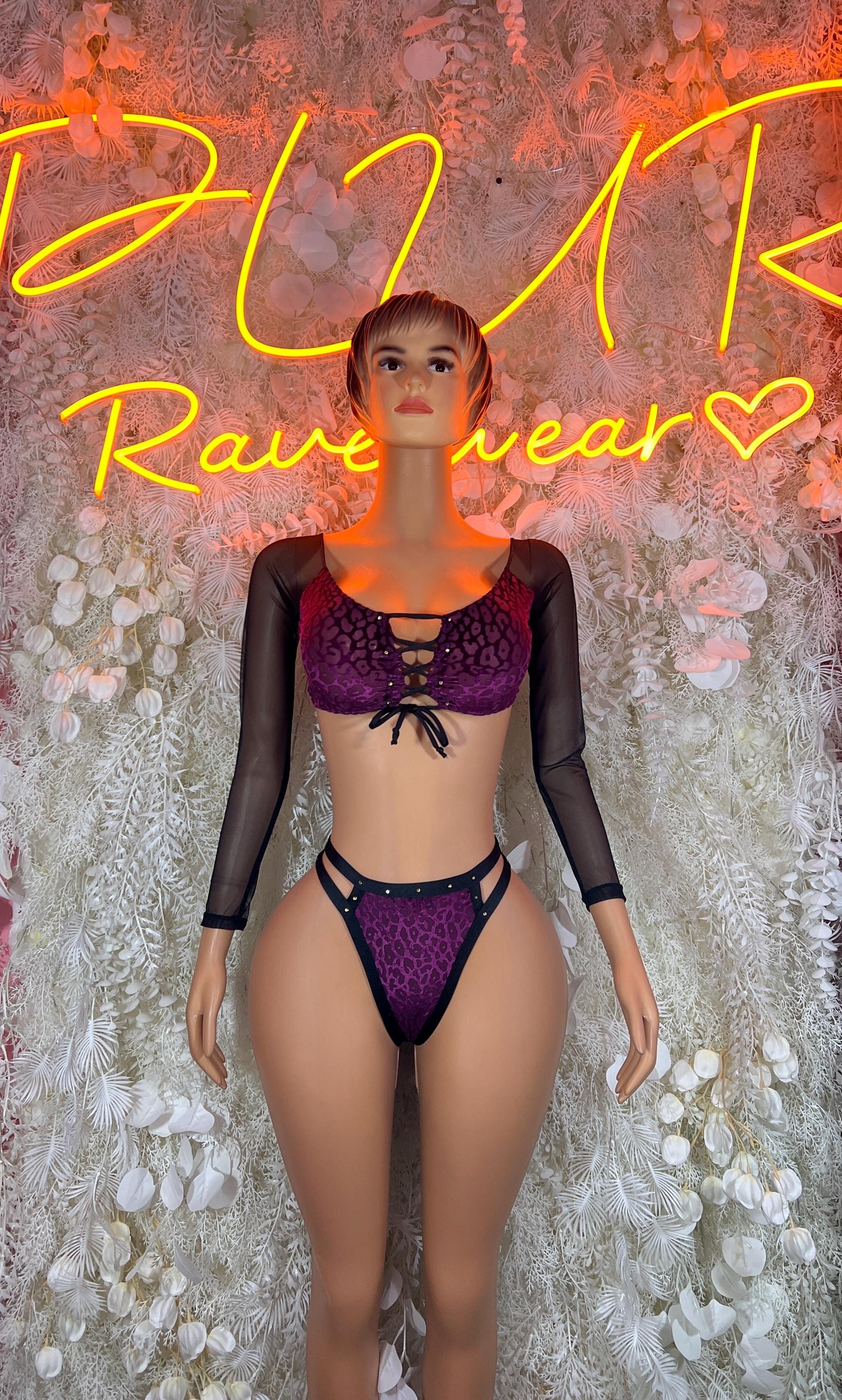 Purple cheetah-print two-piece set with sheer long sleeves and matching thong
