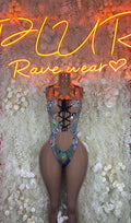 Black rave bodysuit with crisscross lace-up front and side cutouts