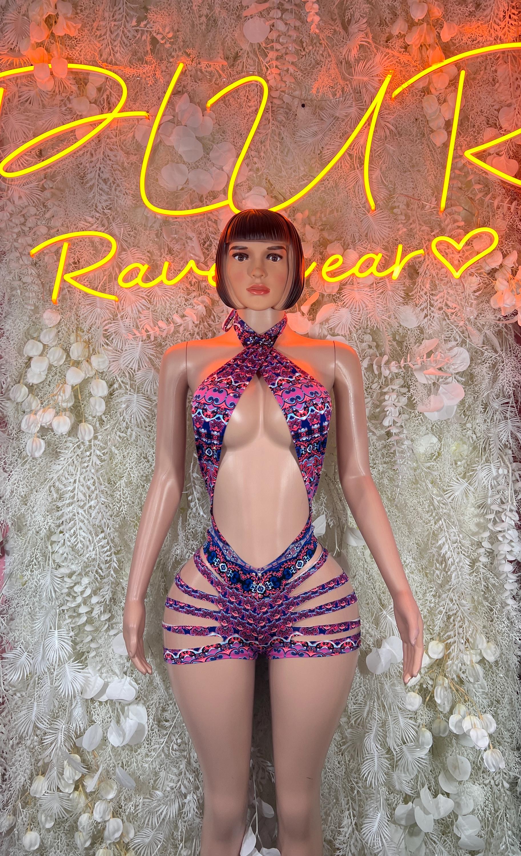Multicolor halter bodysuit with strappy back and purple-blue patterned shorts