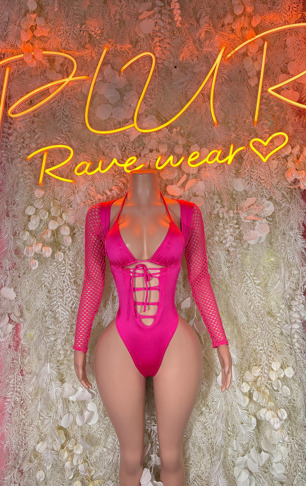 Pink mesh rave bodysuit with long sleeves, V-neck and lace-up front, one-piece
