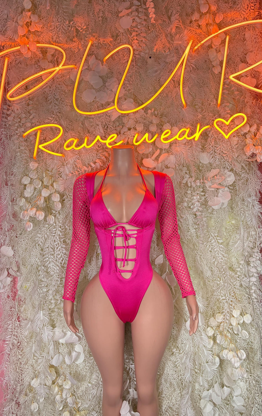 Pink rave bodysuit with mesh long sleeves and lace-up front cutout