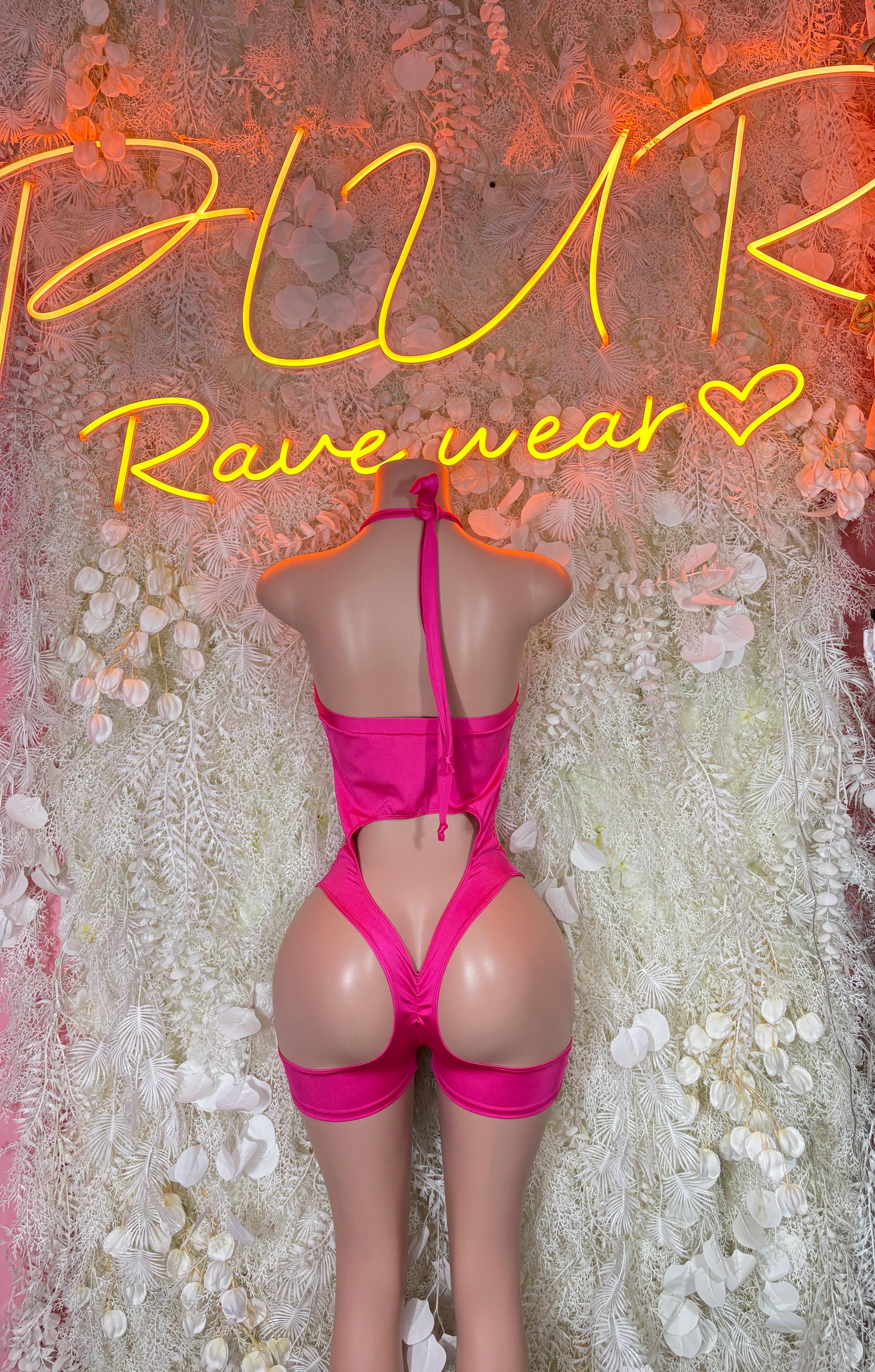 Pink fishnet bodysuit with crossed back straps and high-cut shorts