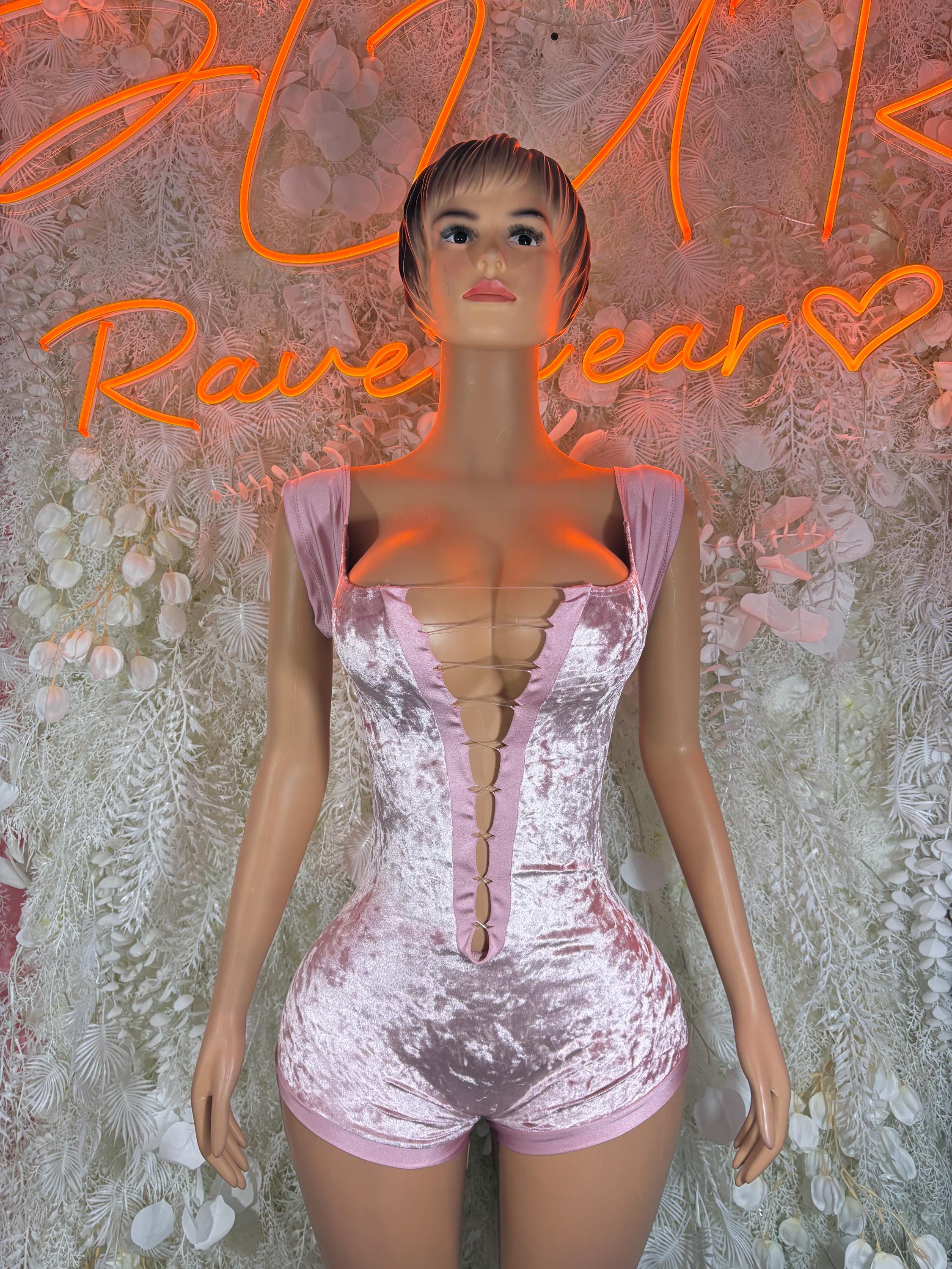 Pink velvet one-piece bodysuit with sweetheart neckline, ruched bust, short legs.