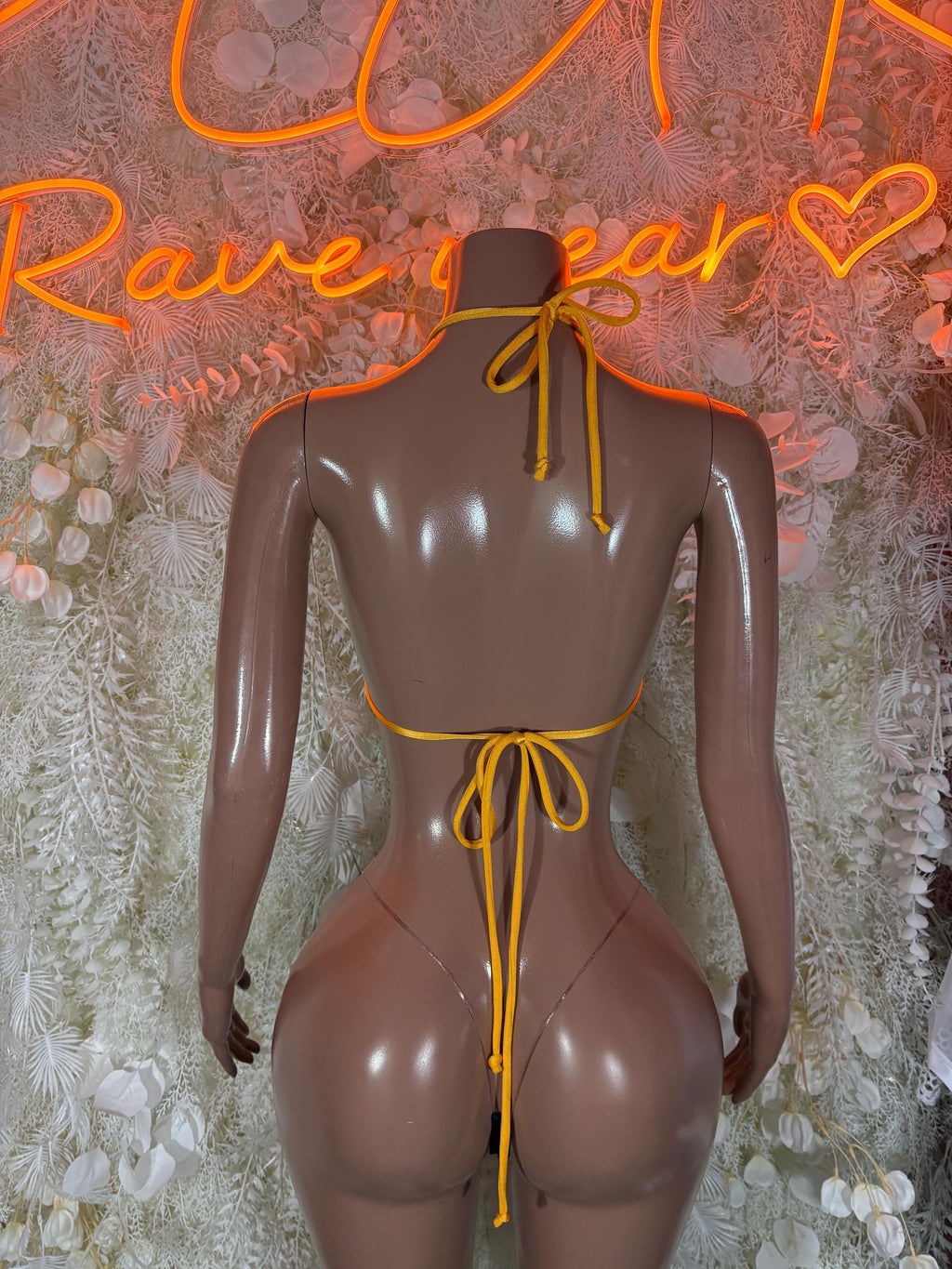 Jamaican flag bikini back view: yellow tie strings, green/black triangle top, thong