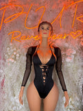 Black bodysuit with lace-up front, deep V neckline and long sheer sleeves