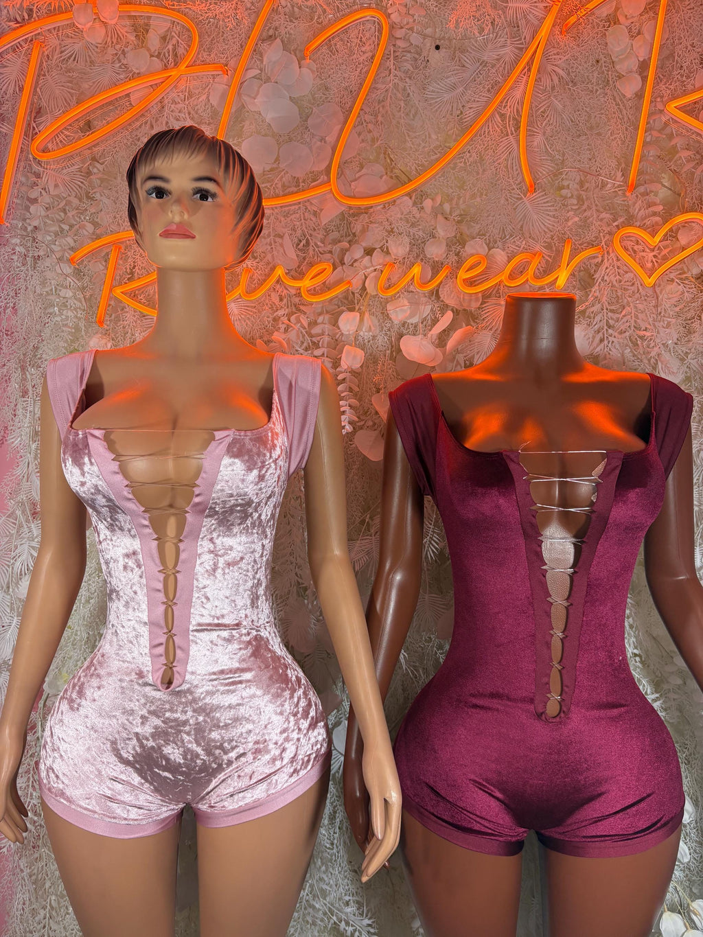 Pink and burgundy velvet one-piece bodysuits with sweetheart neckline and ruched center.