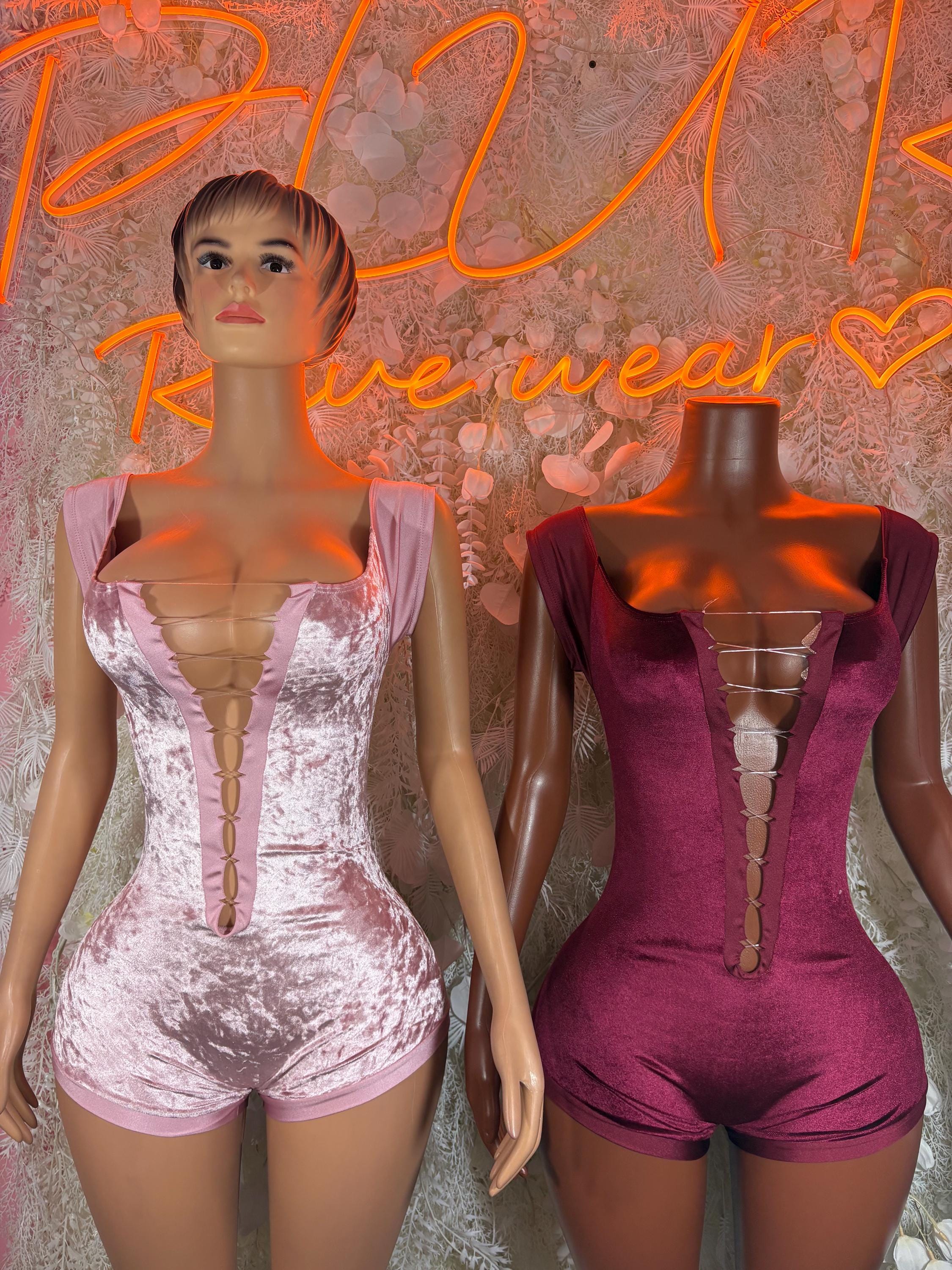 Pink and burgundy velvet one-piece bodysuits with sweetheart neckline and ruched center.
