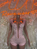 Pink lace one-piece bodysuit with corset lacing front and short sleeve details