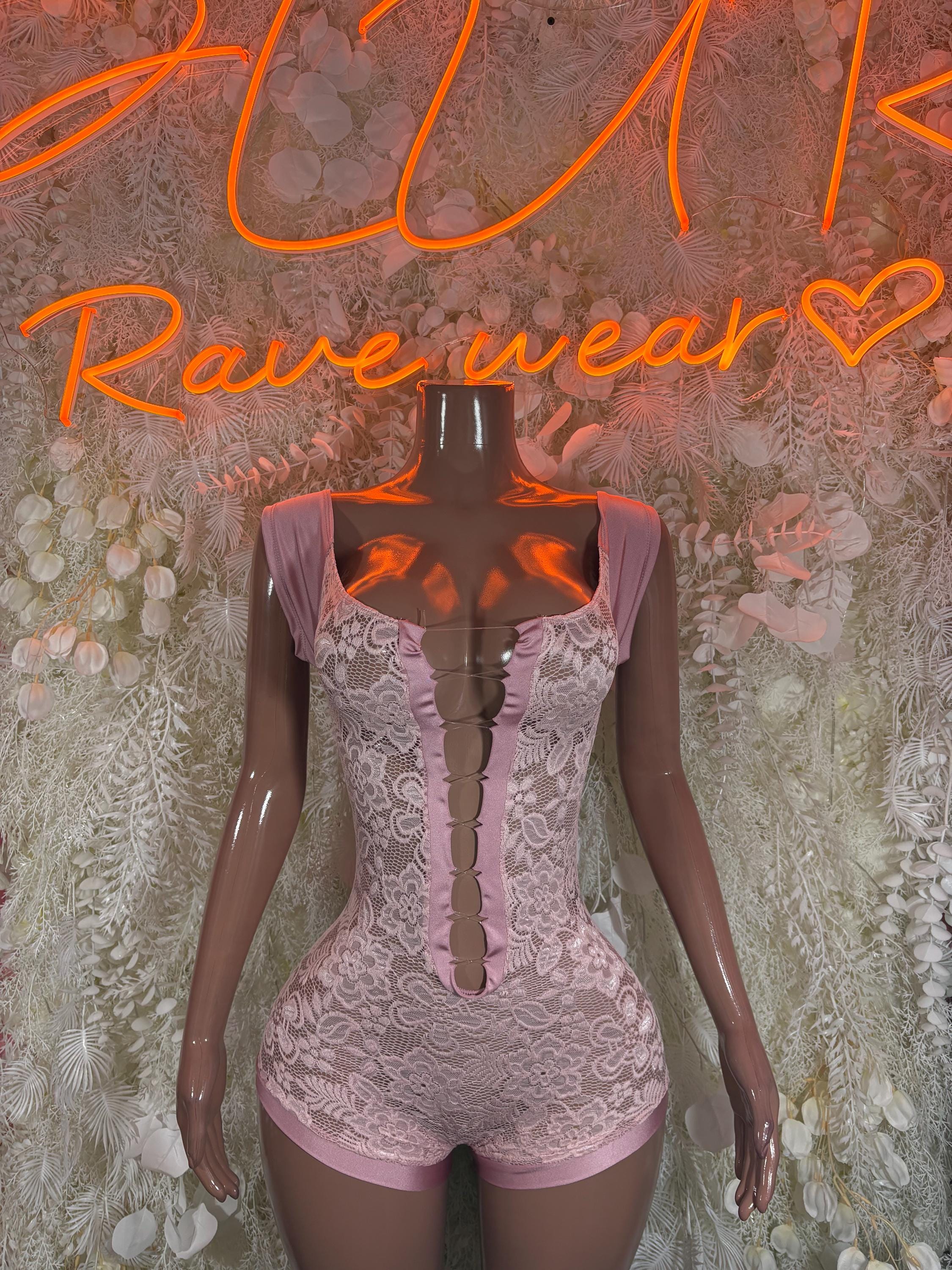 Pink lace one-piece bodysuit with corset lacing front and short sleeve details