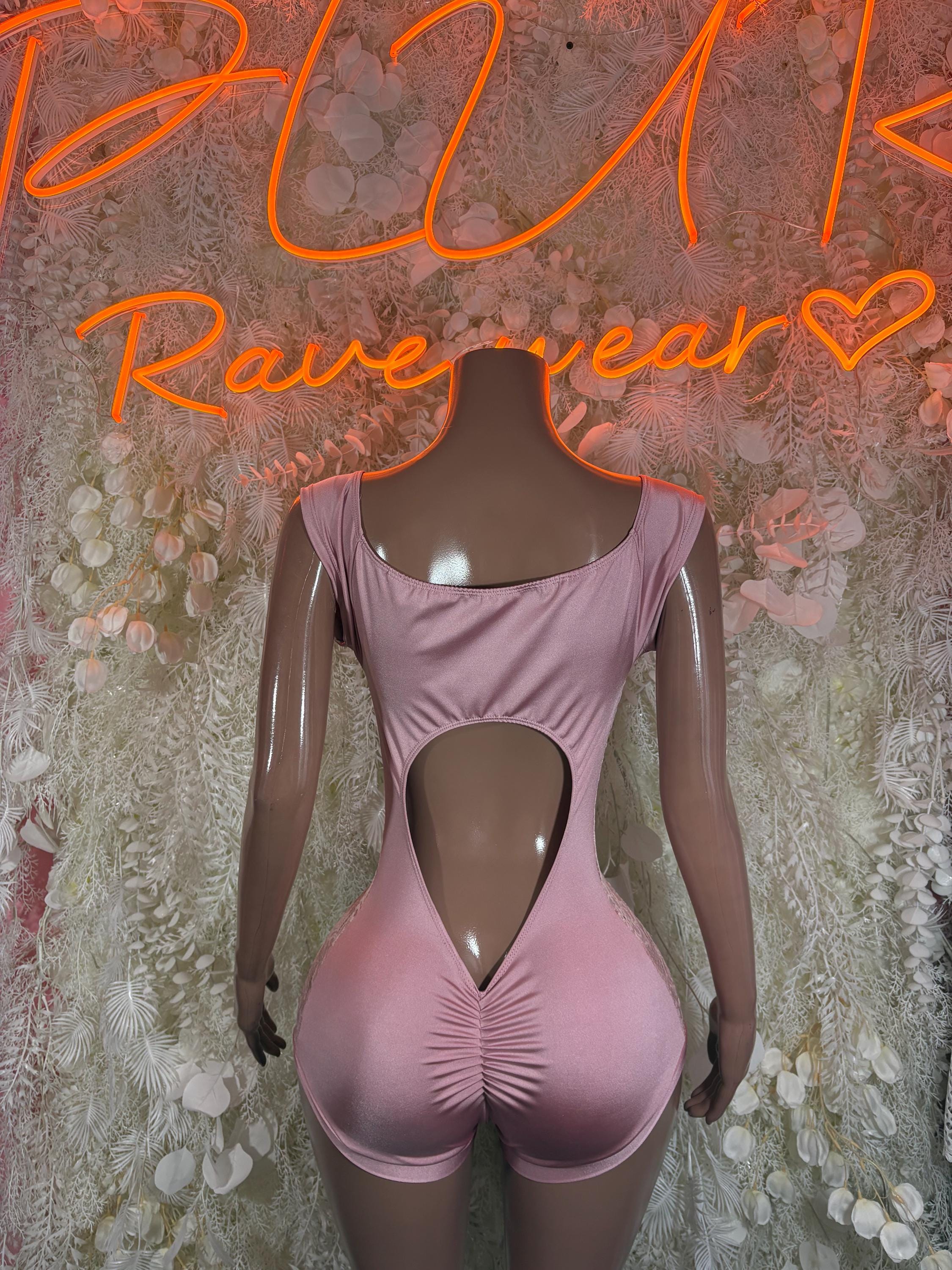 Pink one-piece bodysuit with open back and heart cutout; ruched V-front panel