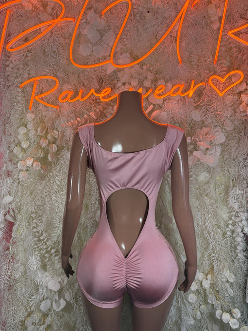 Pink one-piece bodysuit with open back and heart cutout; ruched V-front panel