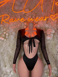 Black high-cut bodysuit with long sheer sleeves and bow-tie back