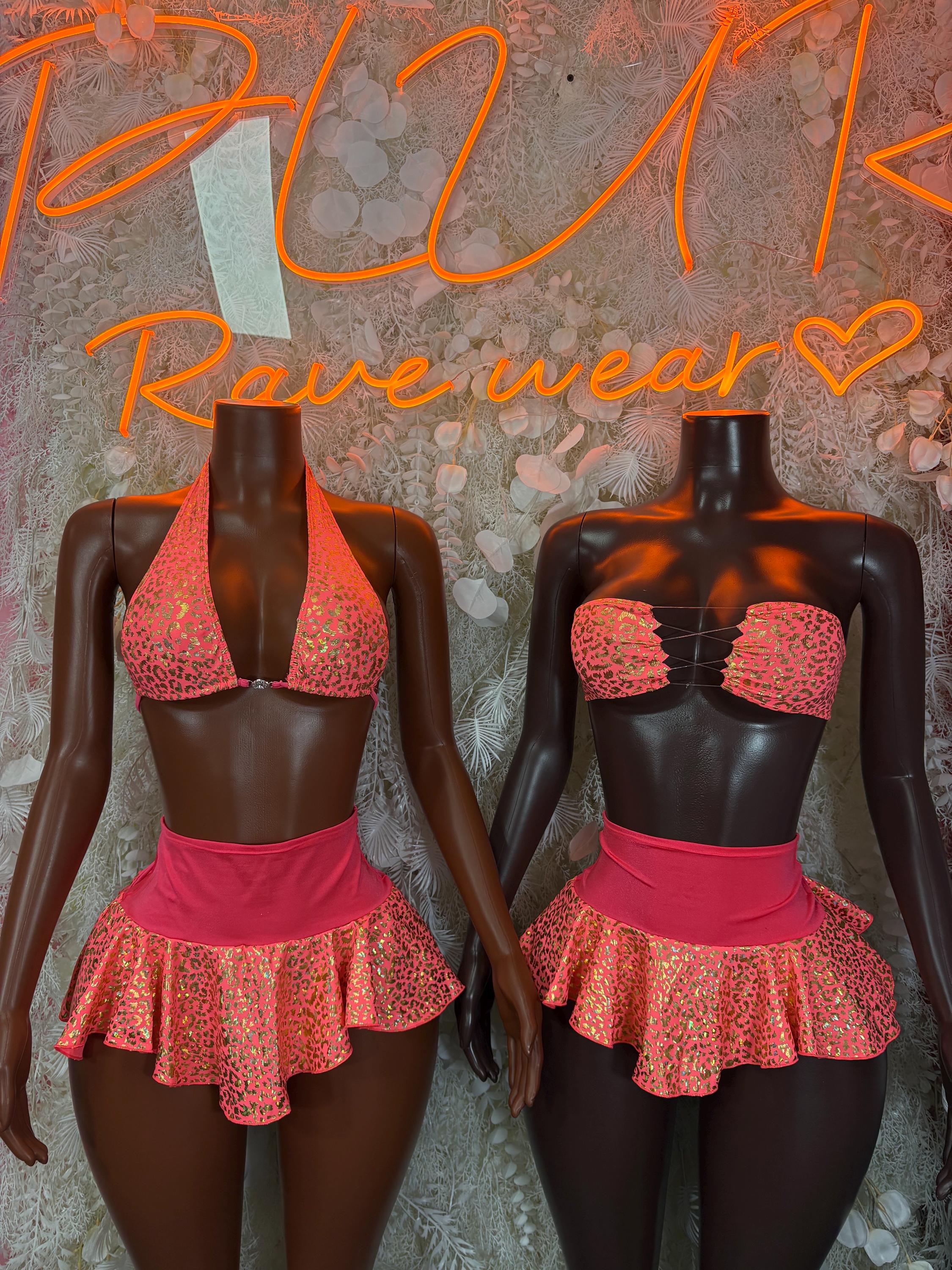 Two mannequins in red animal-print bikini bra and ruffled mini skirt, rave set