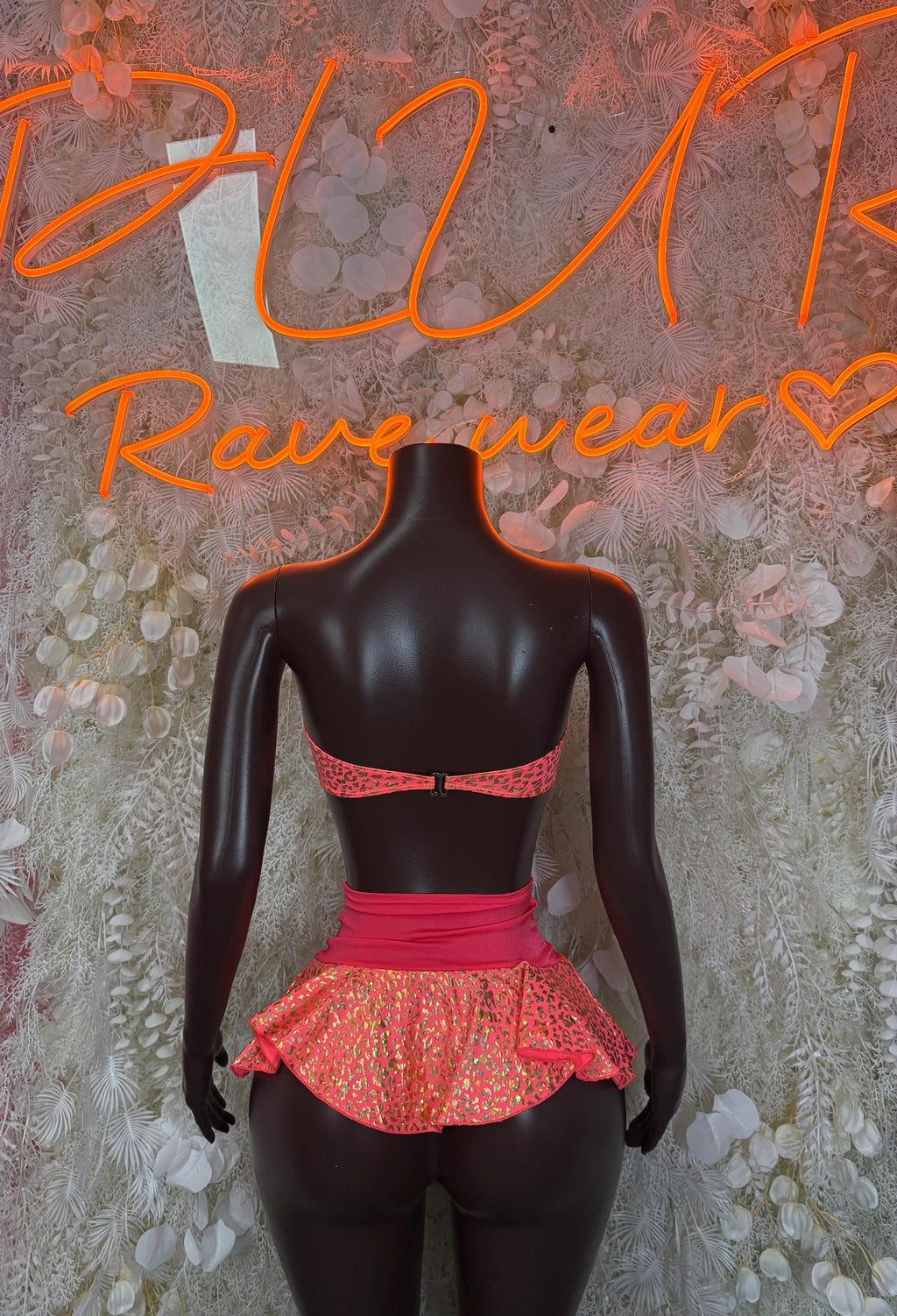 Two-piece rave bralette and ruffled mini skirt set, patterned pink-red with coral waistband back