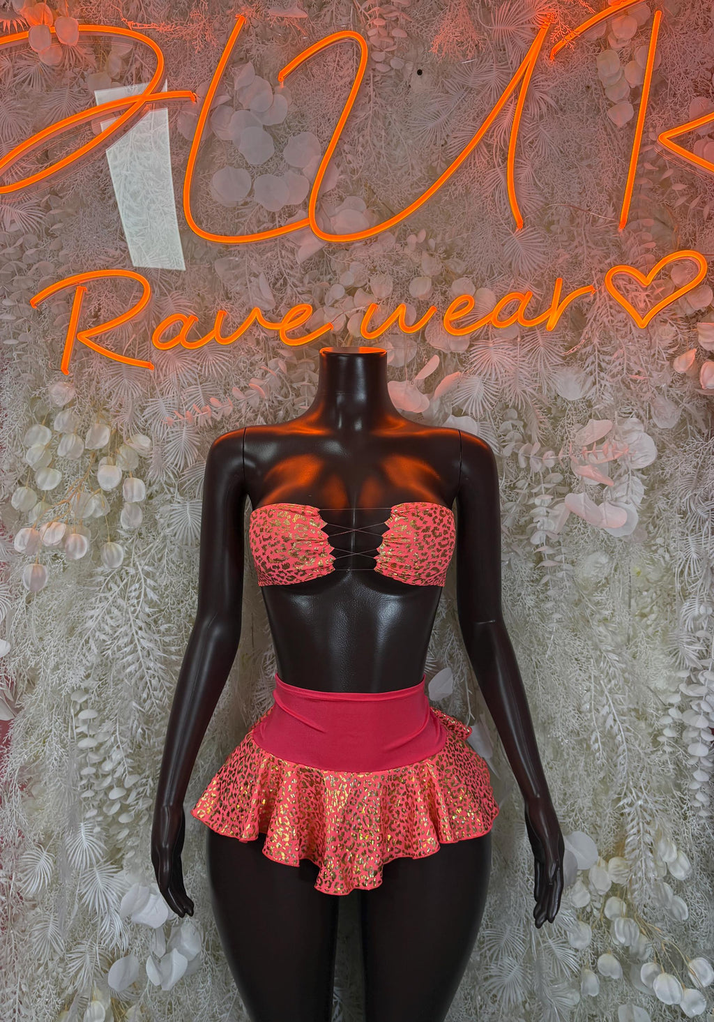 Two-piece rave bralette and ruffled mini skirt set, red/pink leopard print with coral waistband