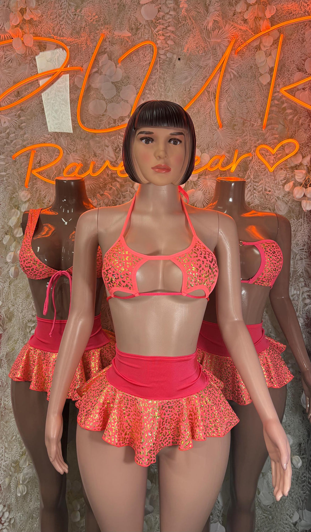 Coral cheetah print bikini skirt set with halter top and layered ruffled mini skirt