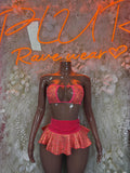 Coral cheetah print skirt set with heart-shaped cutout bikini top and ruffled mini skirt