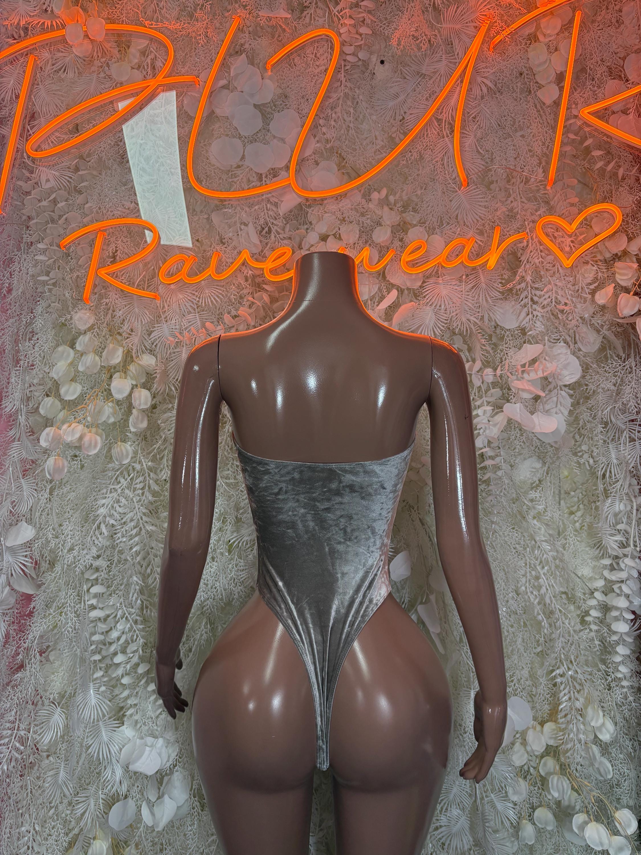 Silver velvet bodysuit with open-back halter straps and high-cut leg