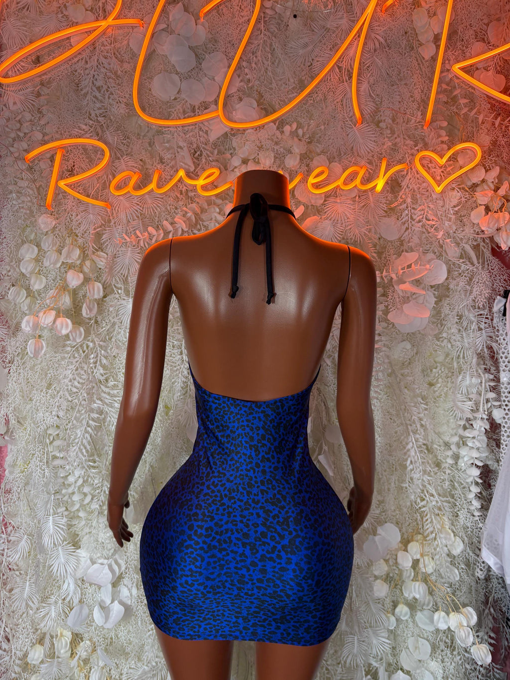 Blue leopard-print mini dress with open back and tie strings at upper back