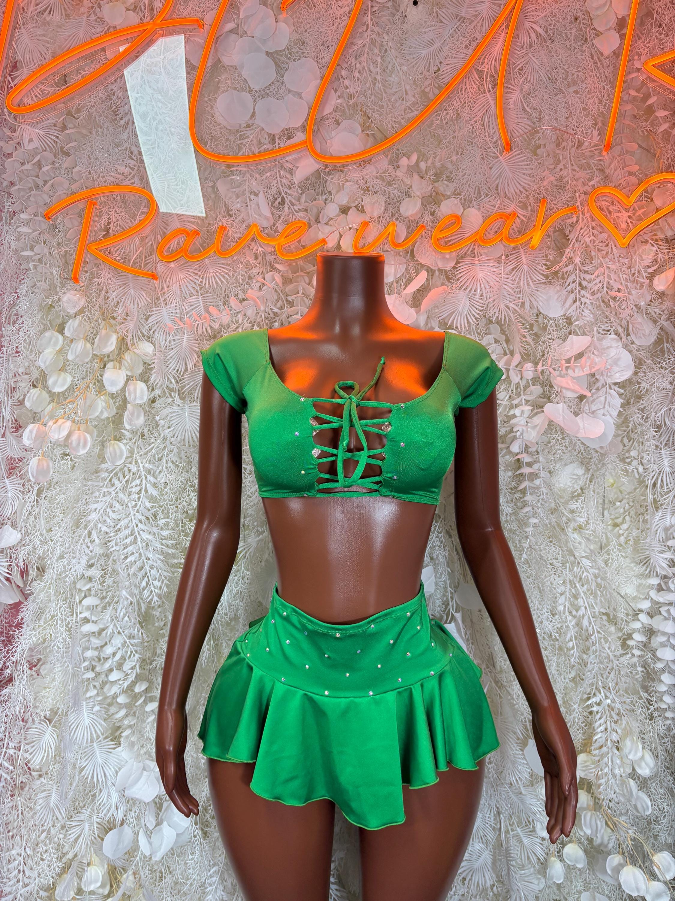 Green two-piece skirt set with lace-up cropped top and flared mini skirt