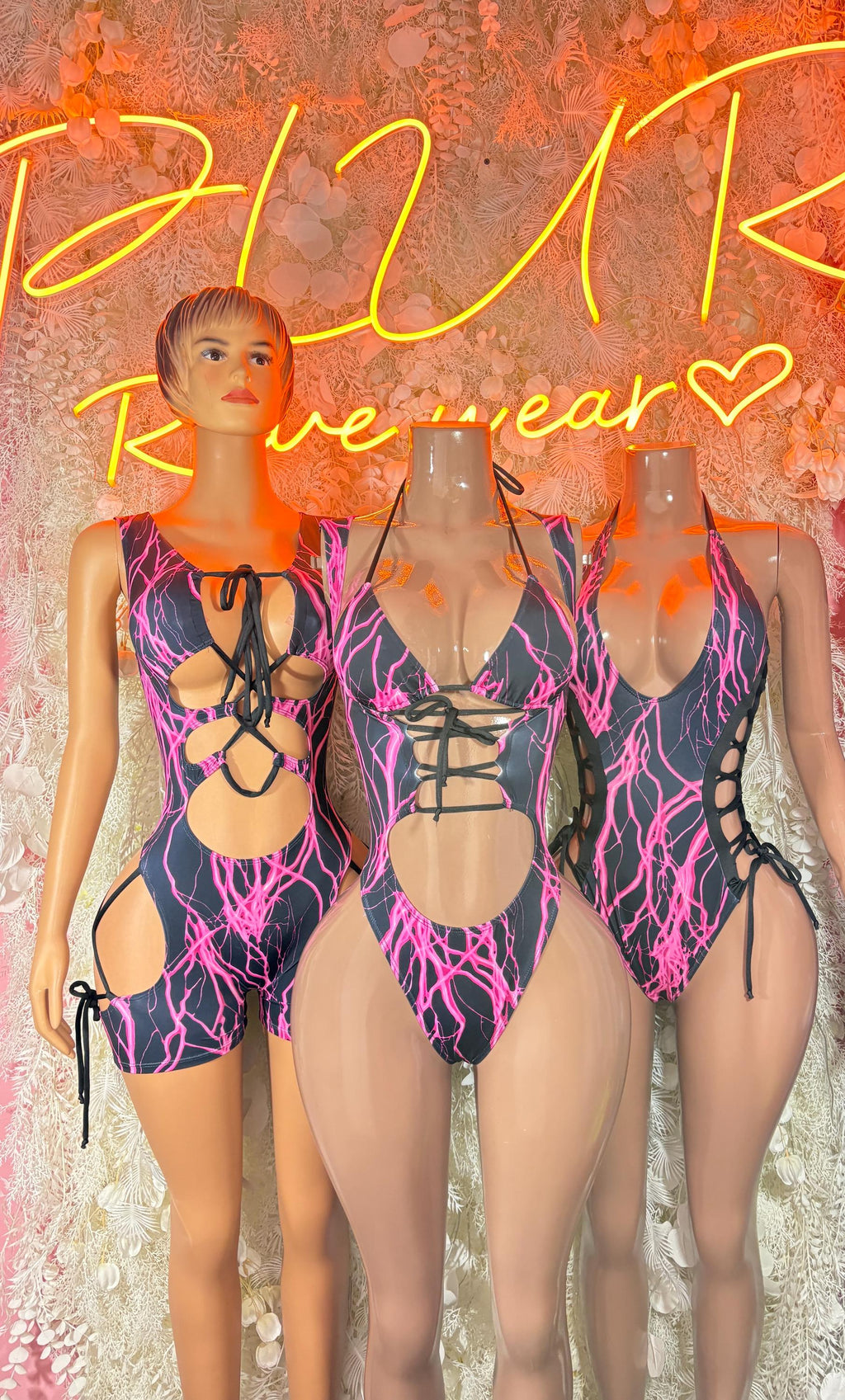Rave lightning-print bodysuit on models, lace-up and cutout front
