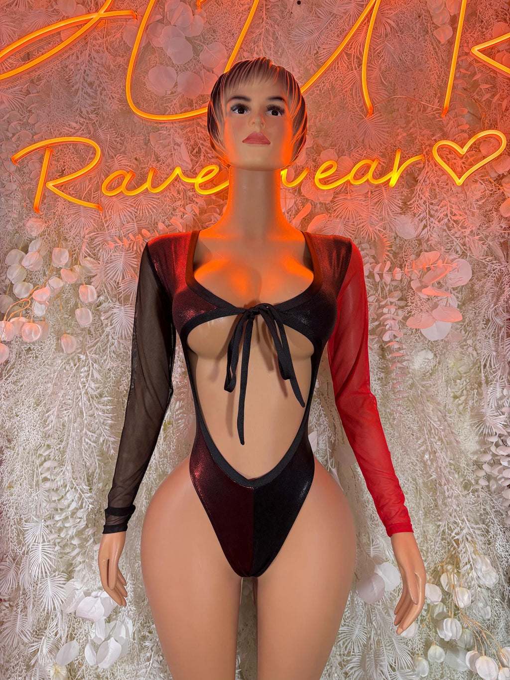 Black and red rave bodysuit with long sleeves, front cutout and lace-up tie