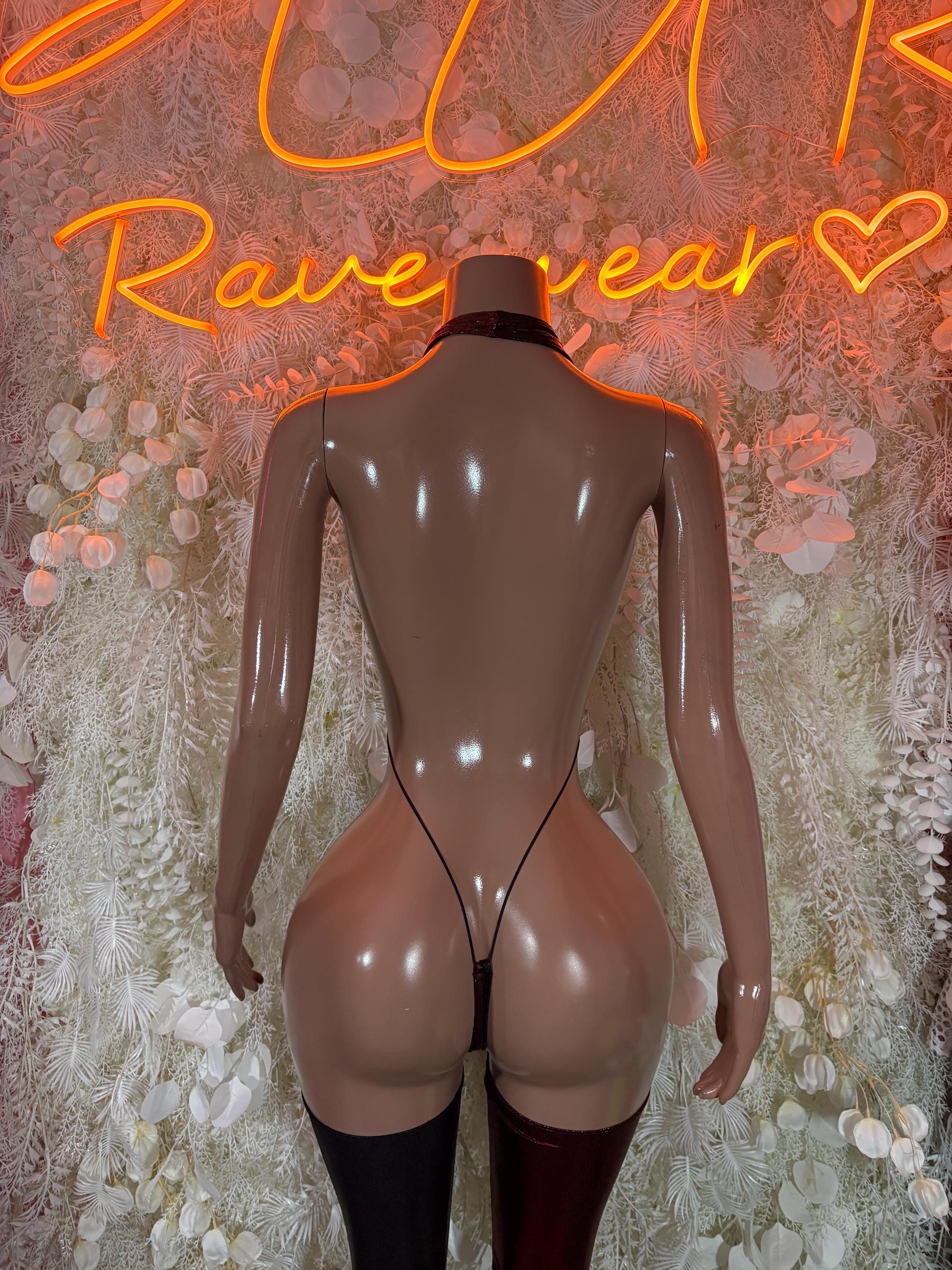 Black lace-up back bodysuit with garter straps and thigh-high stockings