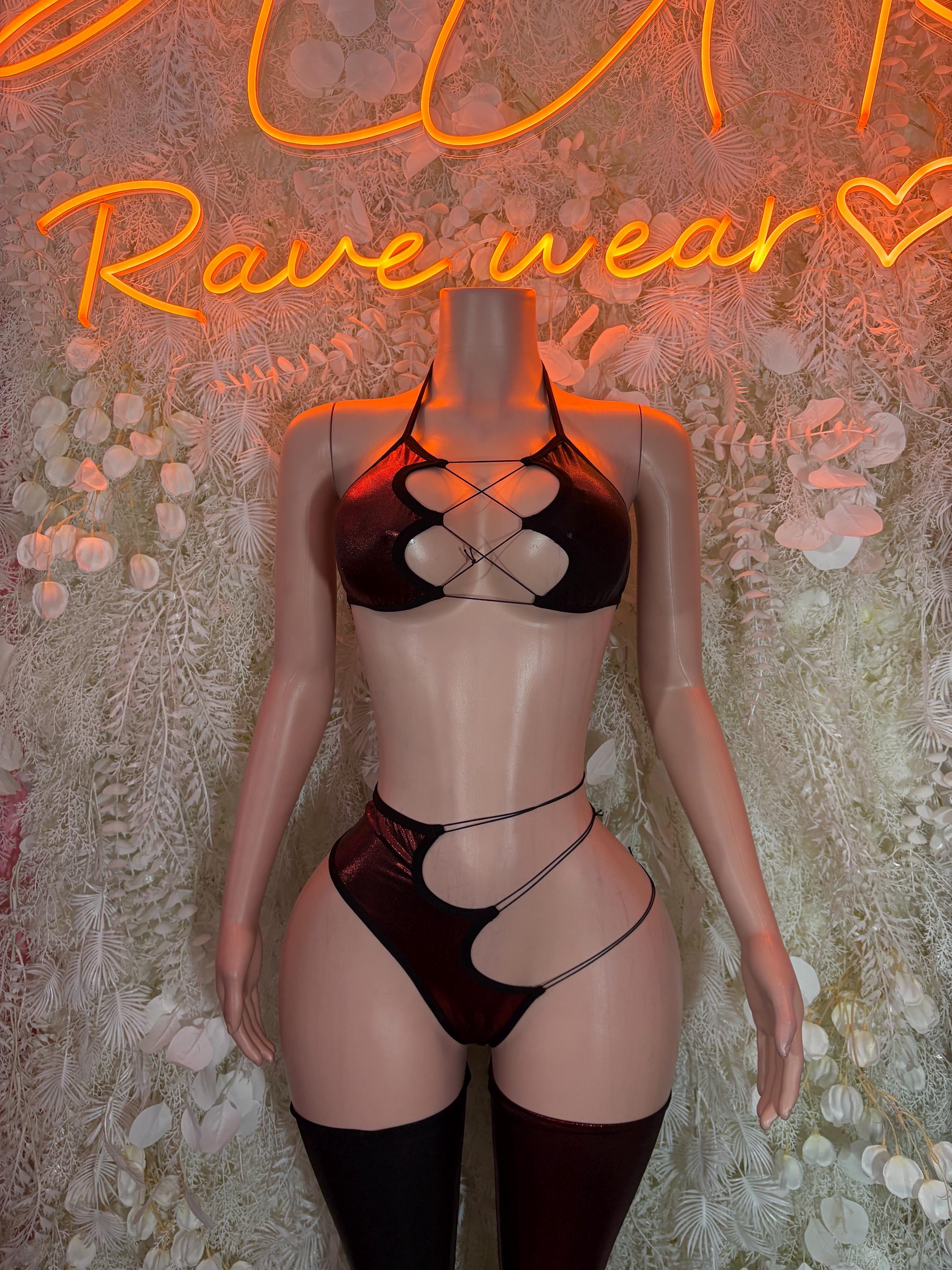 Black strappy two-piece rave outfit with bralette, high-cut bottoms, and thigh bands