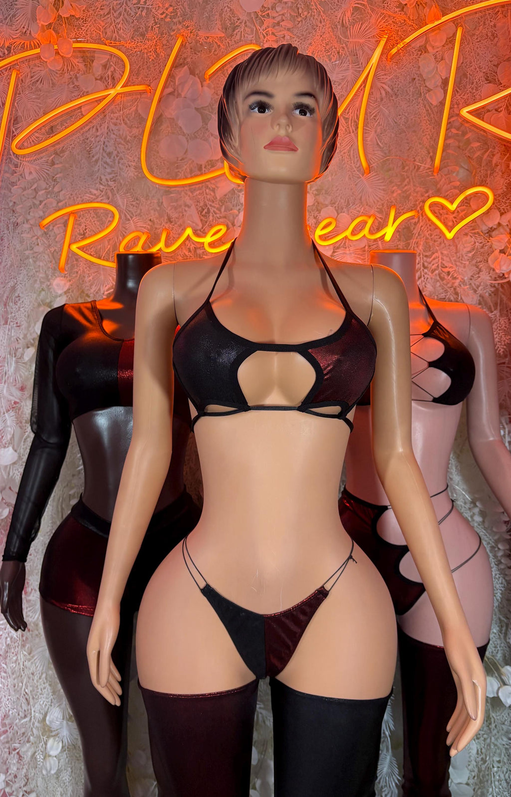 Two-piece rave outfit: black triangle bra top and matching strappy thong-style bottom