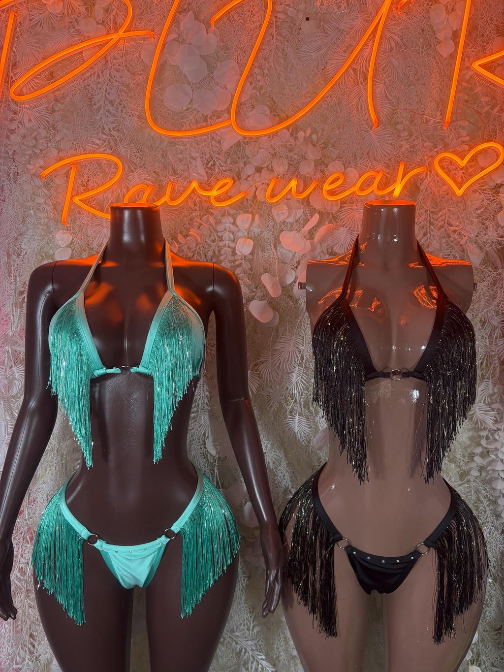 Turquoise and black fringe two-piece sets on mannequins, halter bras and thongs