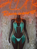 Turquoise fringe two-piece set with halter bra and matching thong bottoms, front view