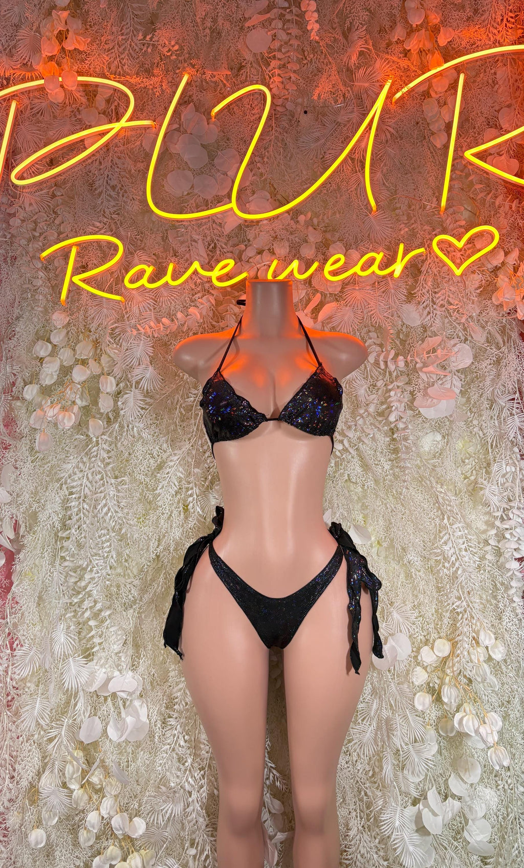 Black two-piece bikini with triangle cups and tie-side bottoms