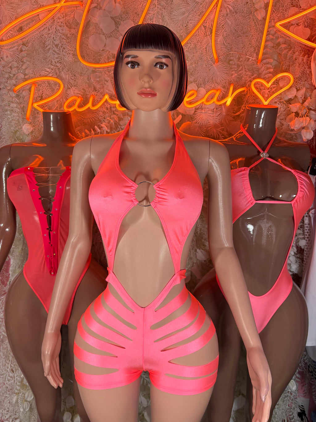 Coral halter cutout bodysuit with chest ring and curved striped panels