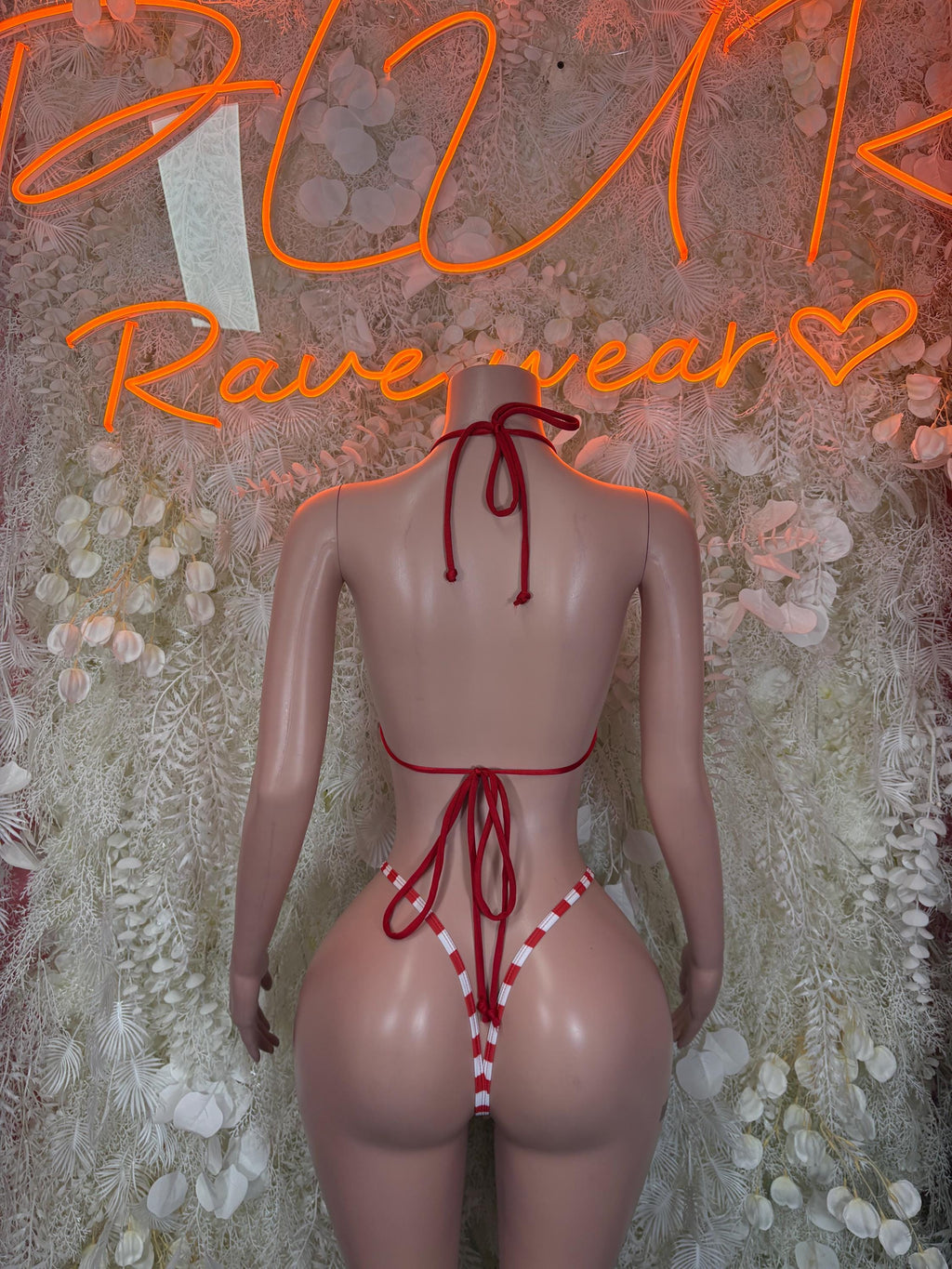 Back view red and white striped bodysuit with crisscross tie straps and thong back